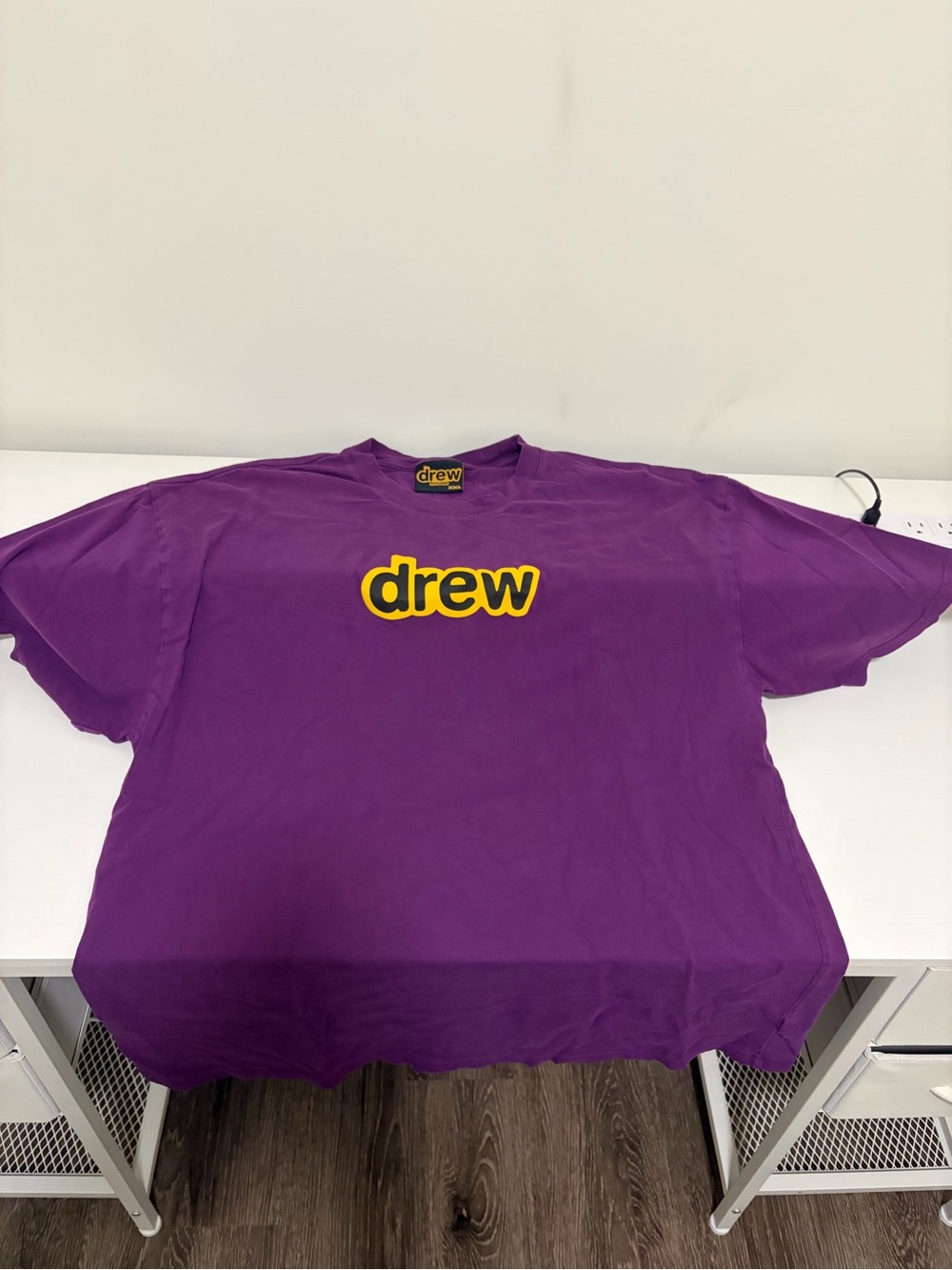drew house purple tee with yellow logo tag